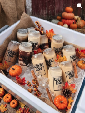 Weekday Brew drinks styled with pumpkins and fall leaves